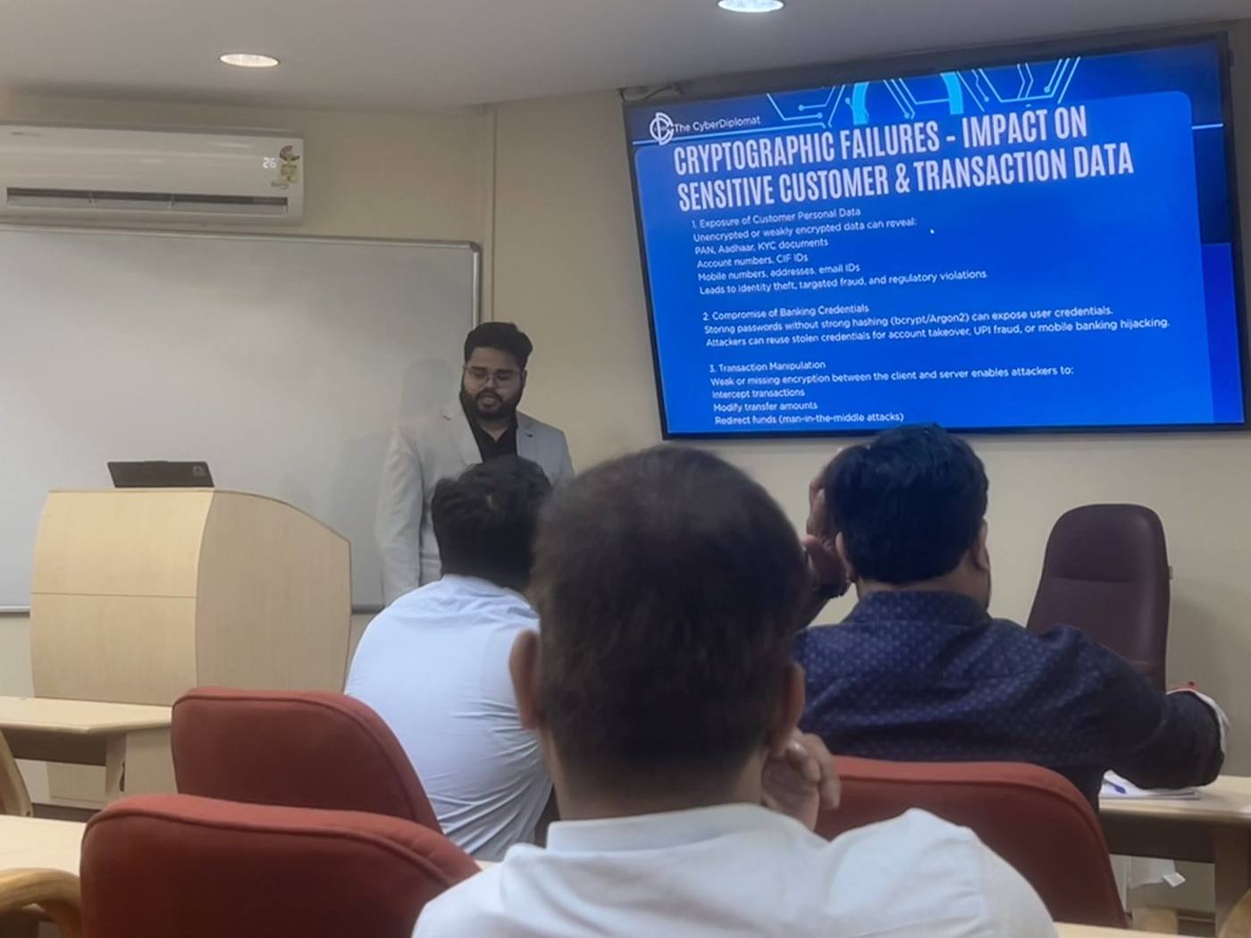 A CyberDiplomat trainer presenting to banking officials