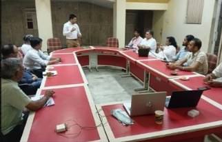 Participants around the conference table during the awareness session