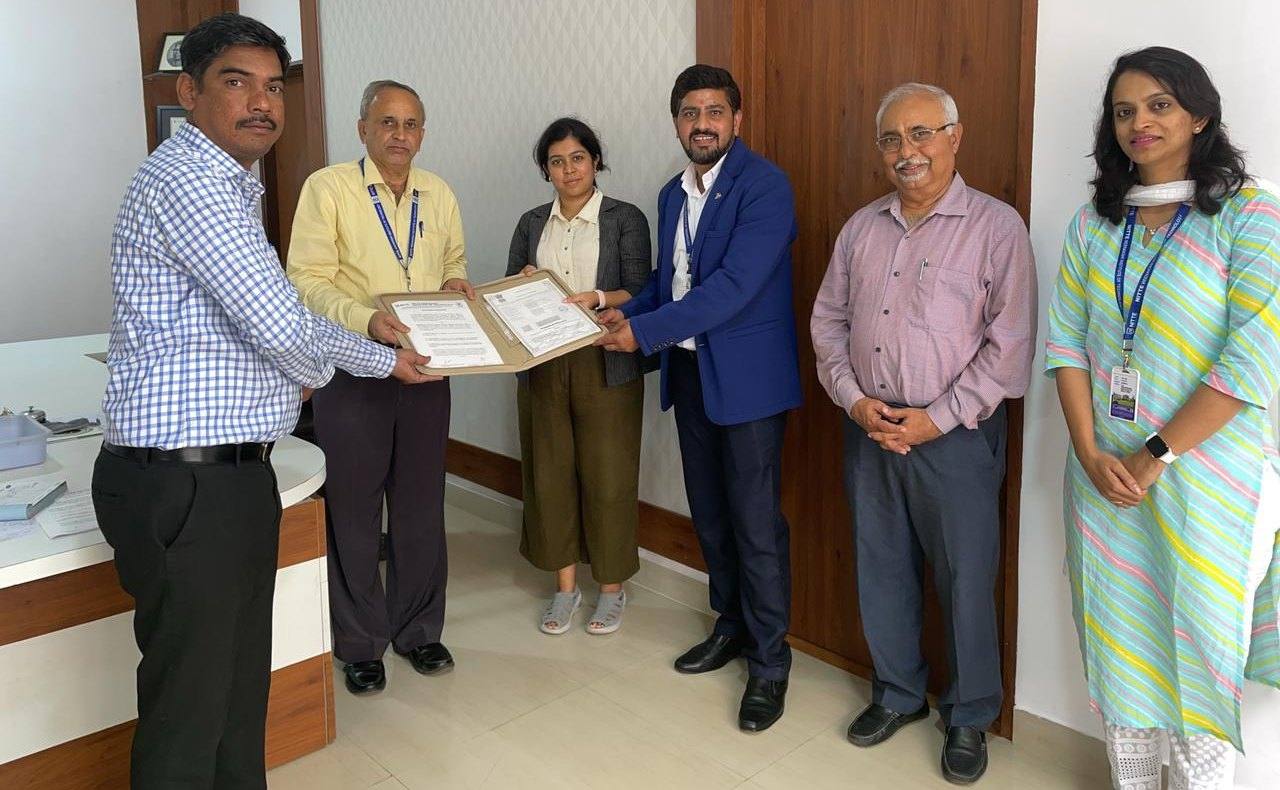 Exchanging the MoU with NITTE Meenakshi Institute of Technology