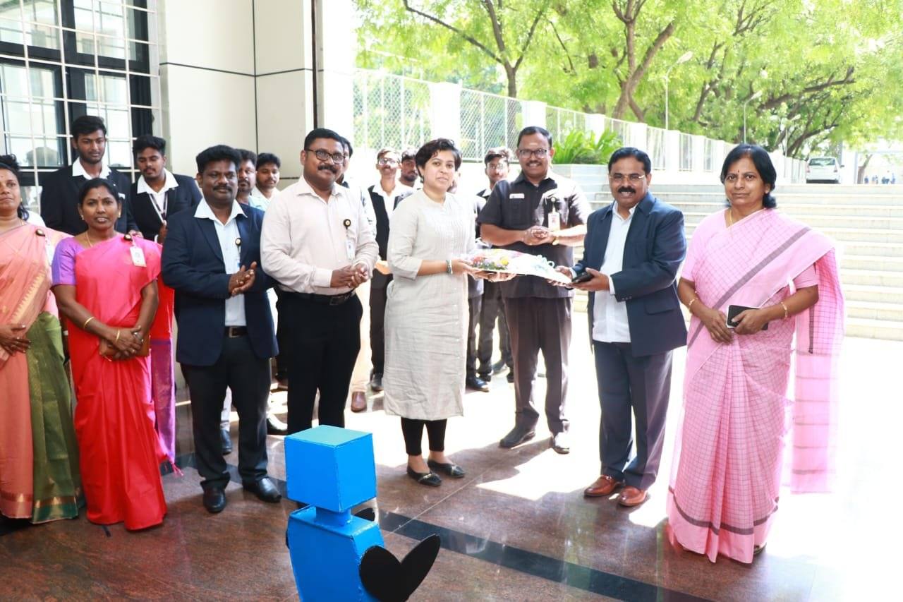 Sanjana Rathi welcomed at Paavai Institutions, with a student-built robot presenting the bouquet