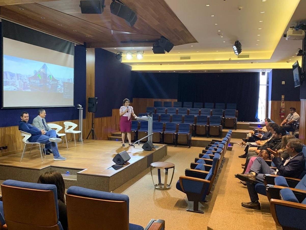 Sanjana Rathi addressing officials in the auditorium at Capital Bank, Panama