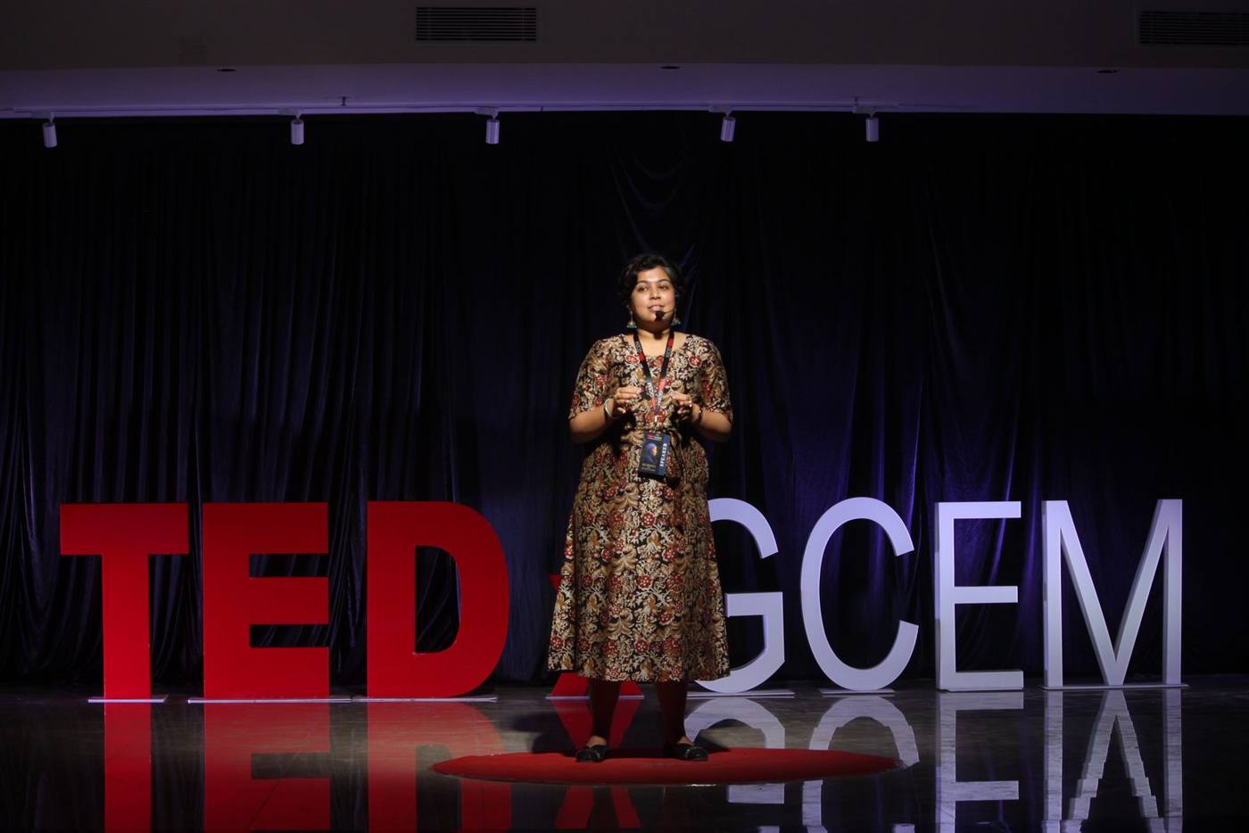 Sanjana Rathi delivering her TEDx talk at TEDxGCEM