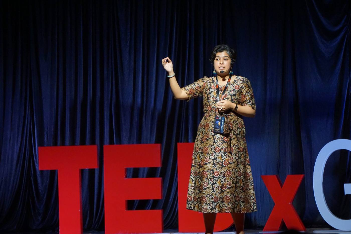 Sanjana Rathi beside the TEDxGCEM lettering